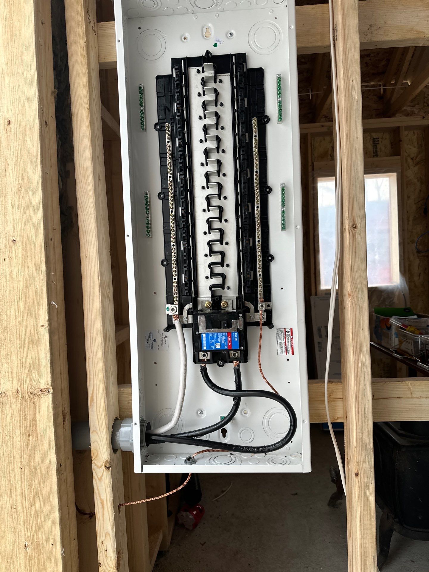 Interior electrical panel infrastructure inside a framed new rural structure
