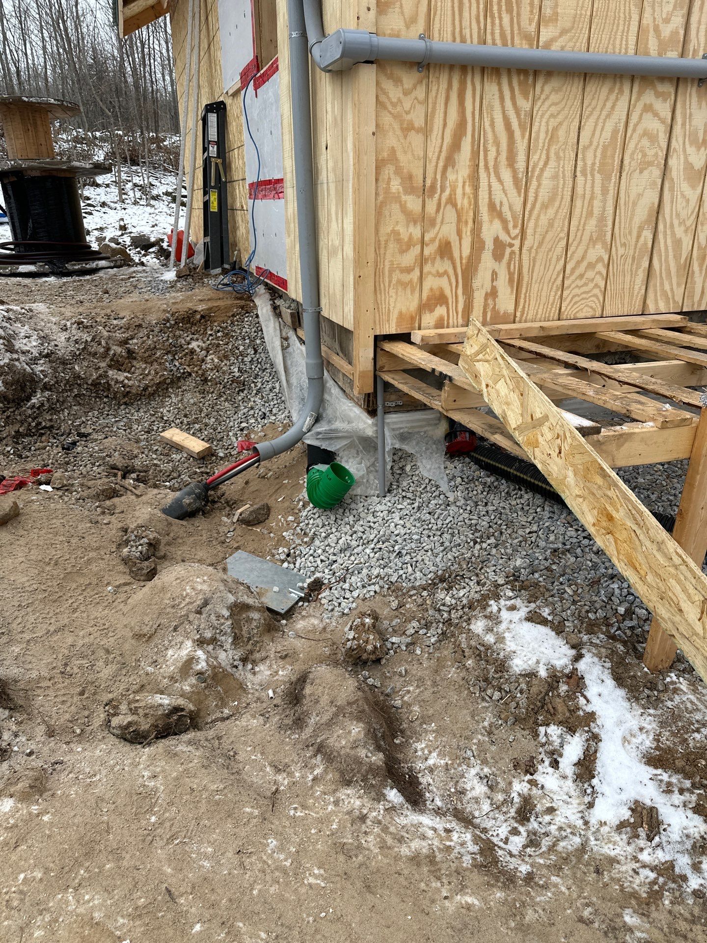 Exterior conduit and service routing at a rural new-build structure